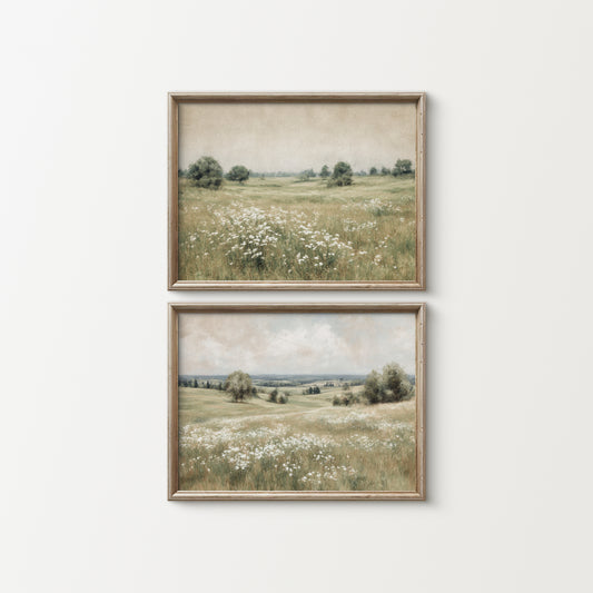 Two framed landscape prints of a field with flowers on a white wall.
