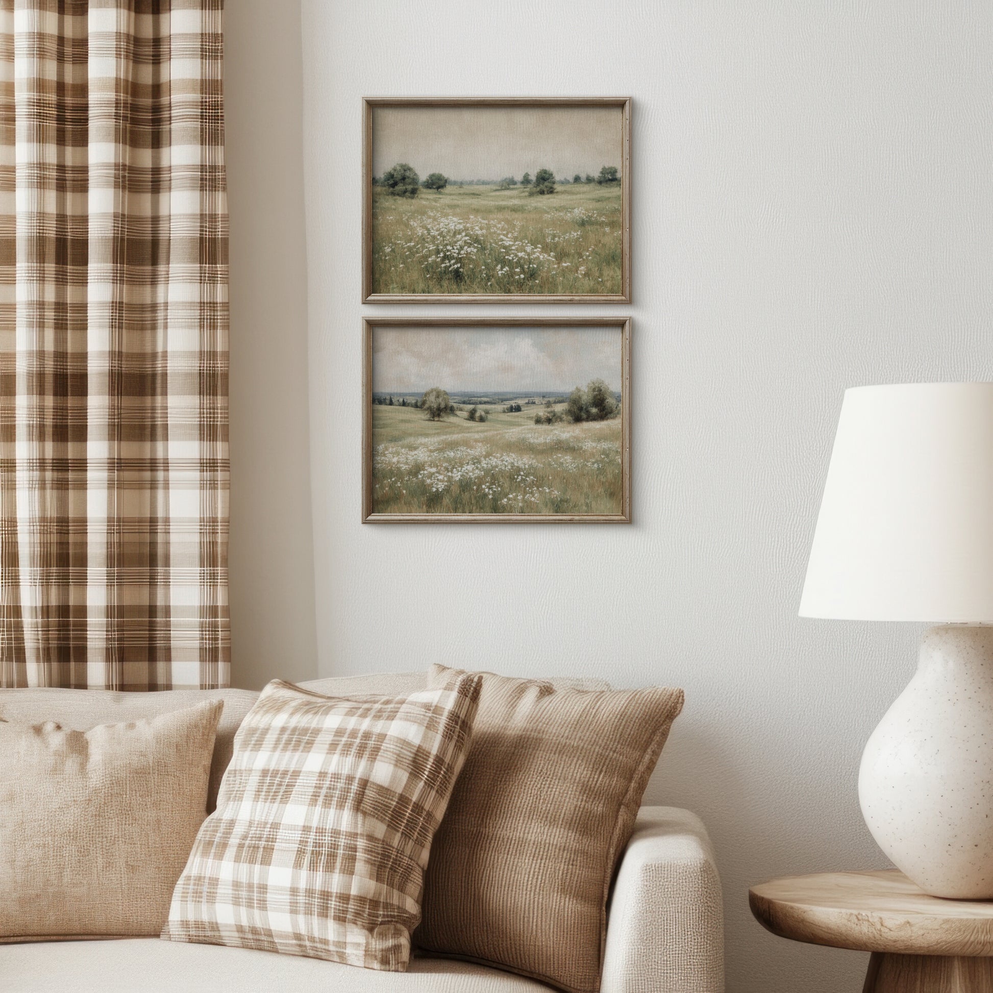 Living room with plaid curtains, sofa, and wall art of landscapes