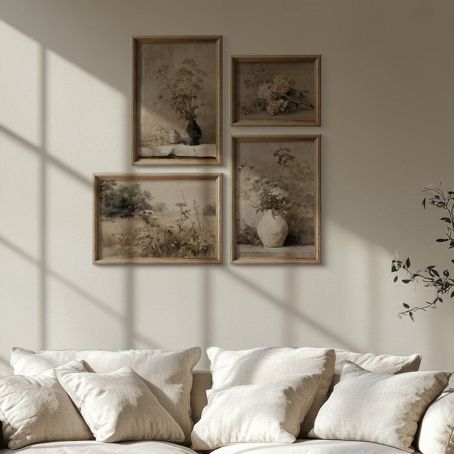White sofa in a sunlit room with framed artwork on the wall.