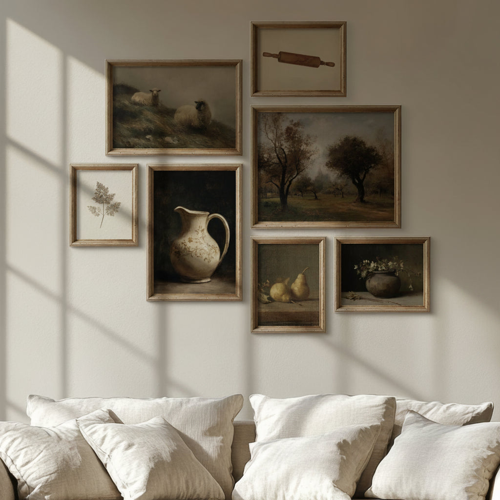 Beige sofa with cushions in a room with framed pictures on the wall.
