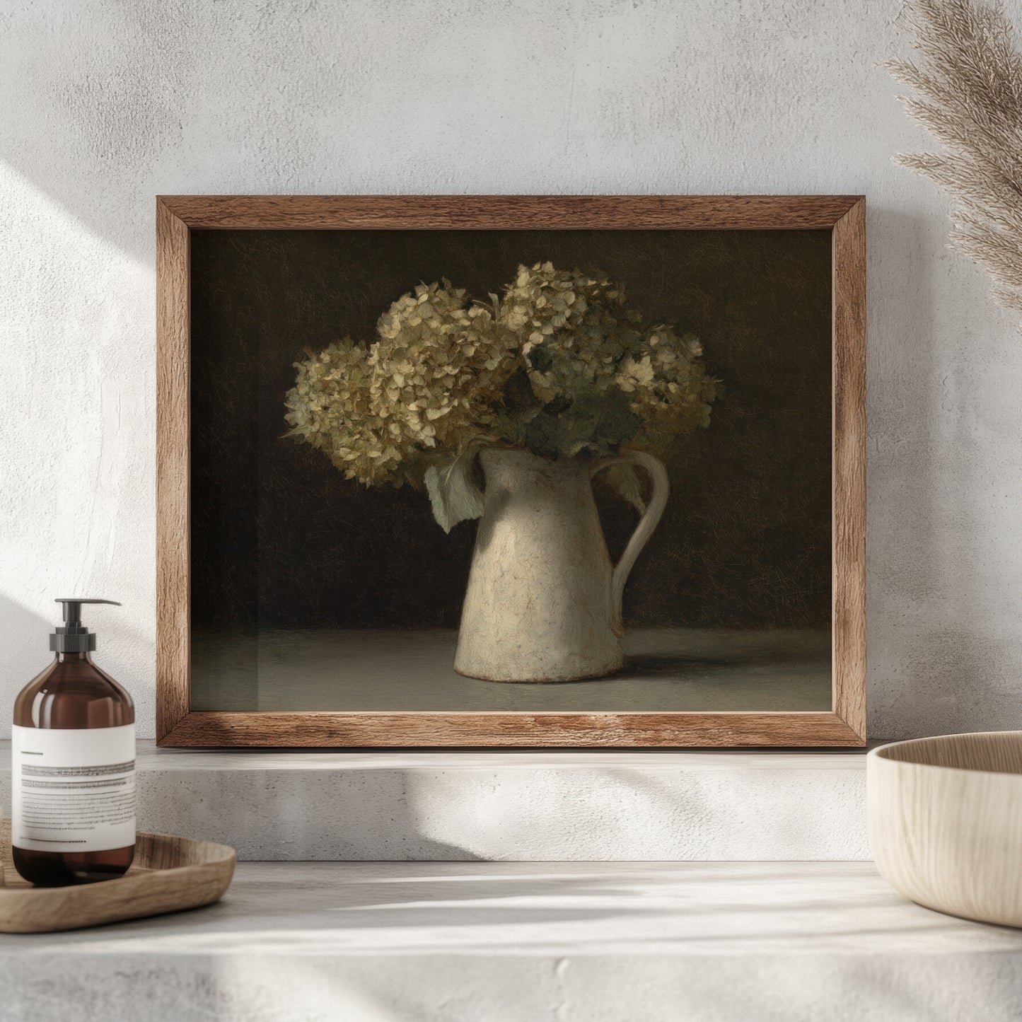 Framed artwork of a still life with flowers in a pitcher on a shelf.