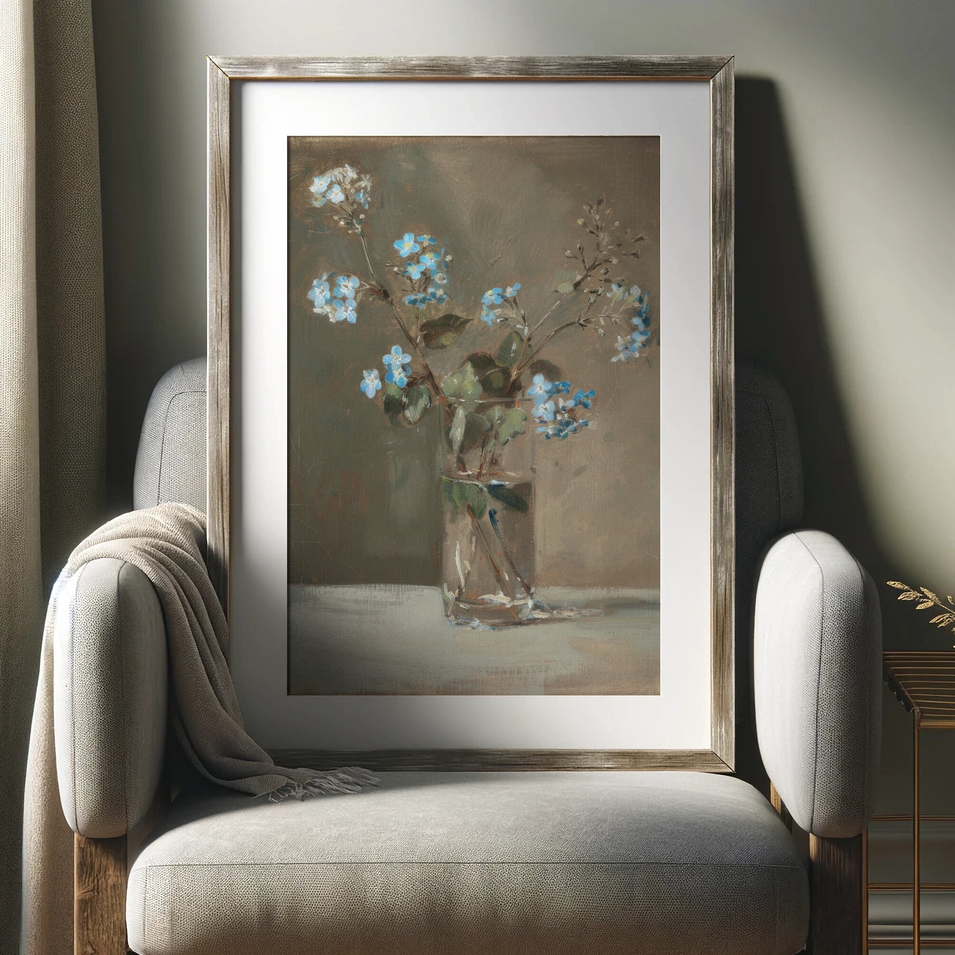 Framed painting of flowers on a wall above a chair