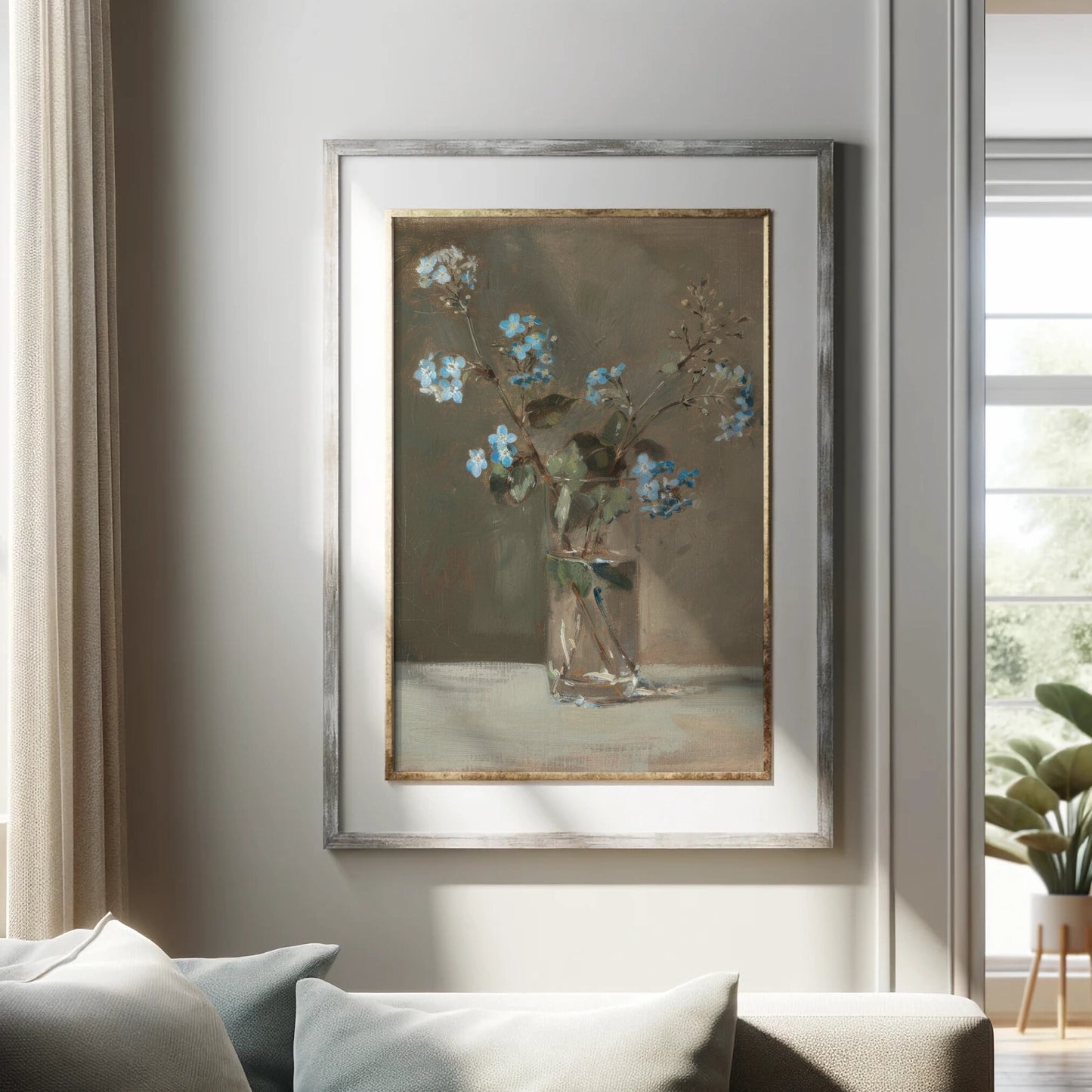 Framed painting of flowers on a wall in a living room