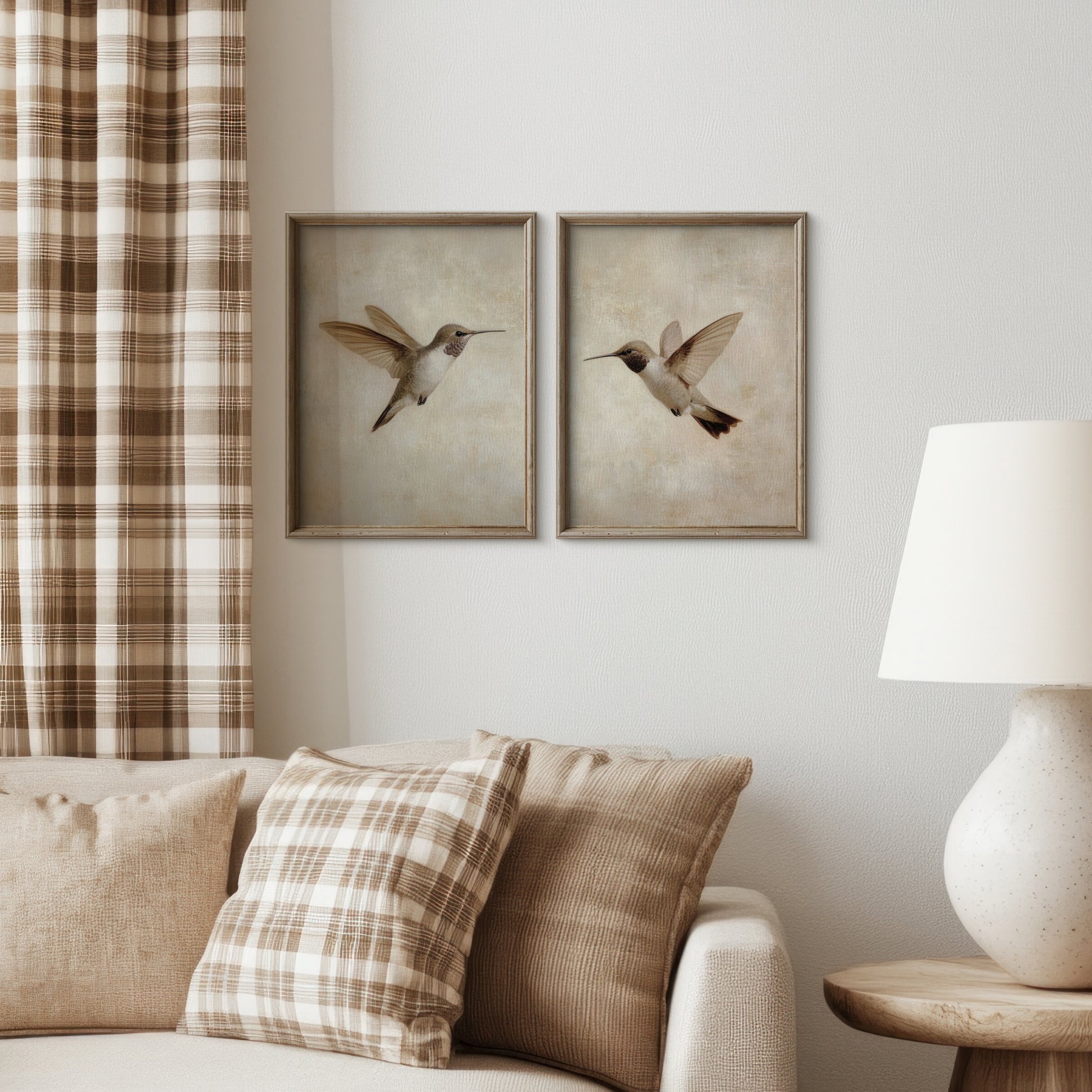 Living room with framed artwork of birds on the wall, plaid curtains, and a lamp.