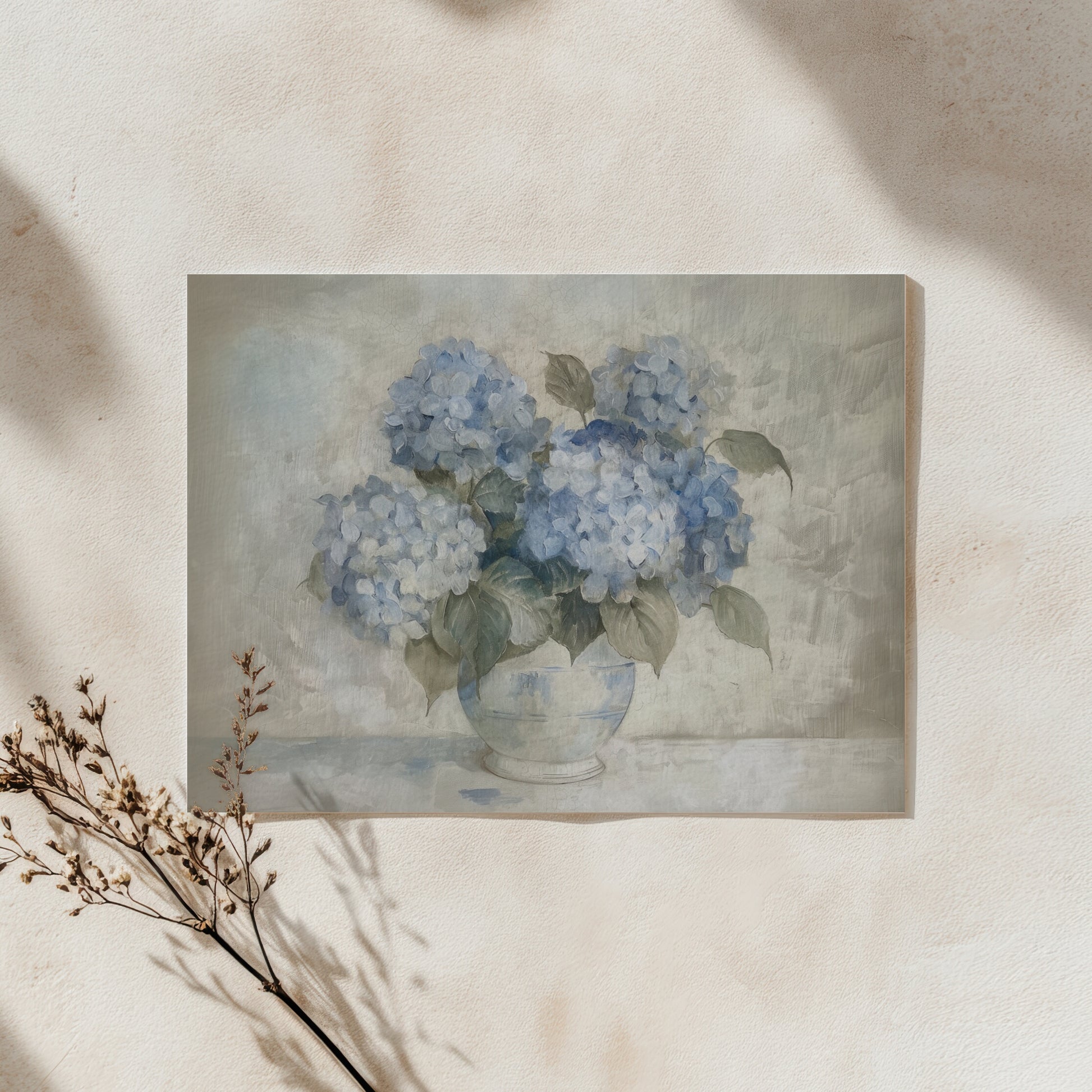 Painting of blue hydrangeas in a vase on a textured wall.