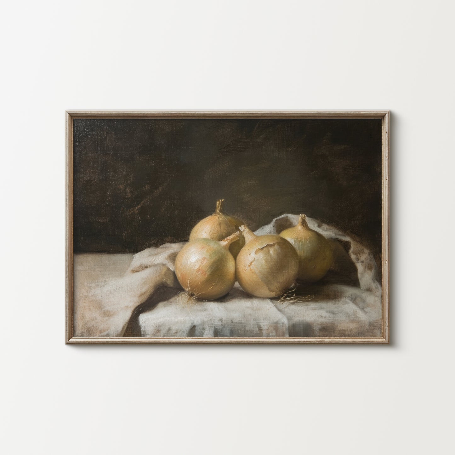 Framed artwork of onions on a cloth with a dark background