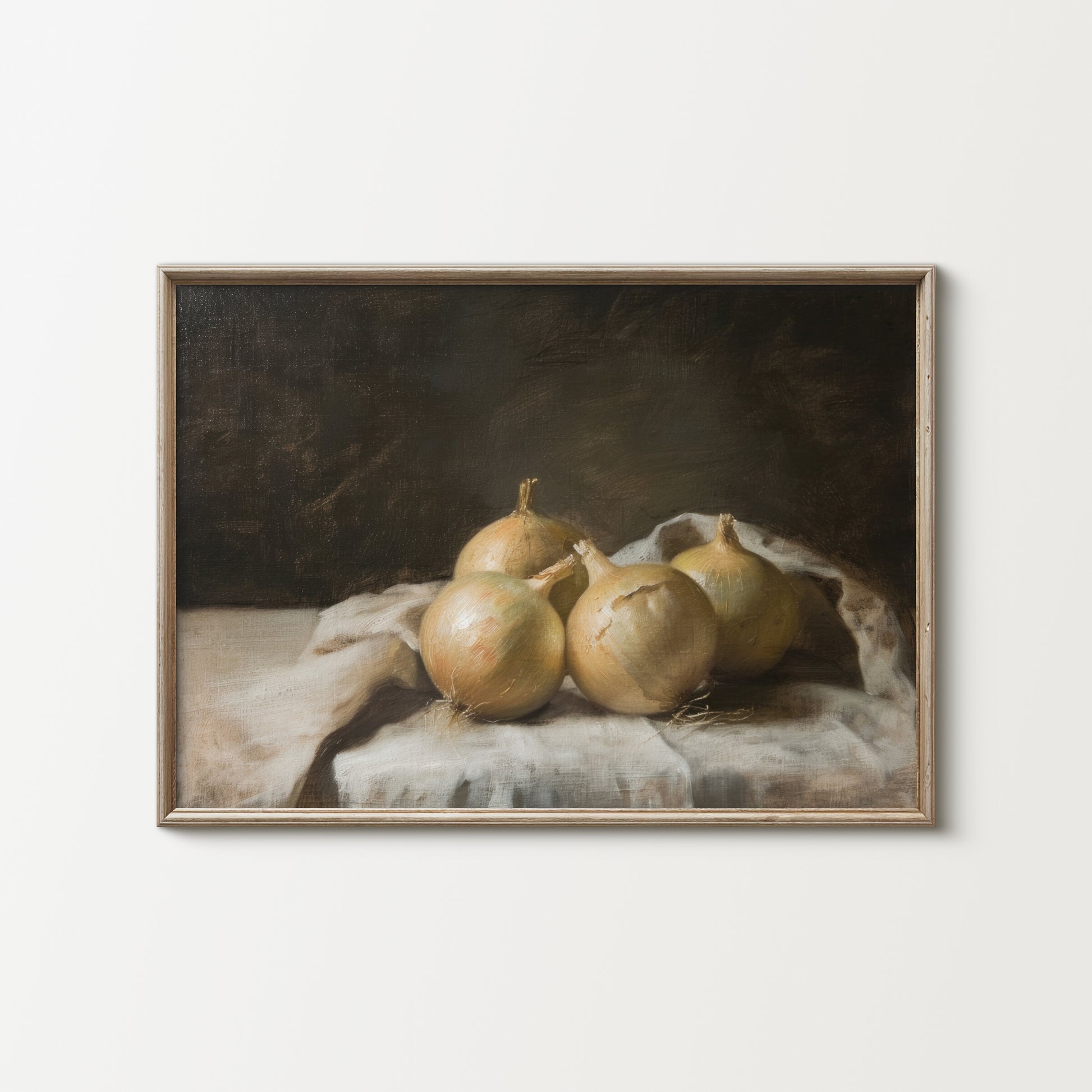 Framed artwork of onions on a cloth with a dark background