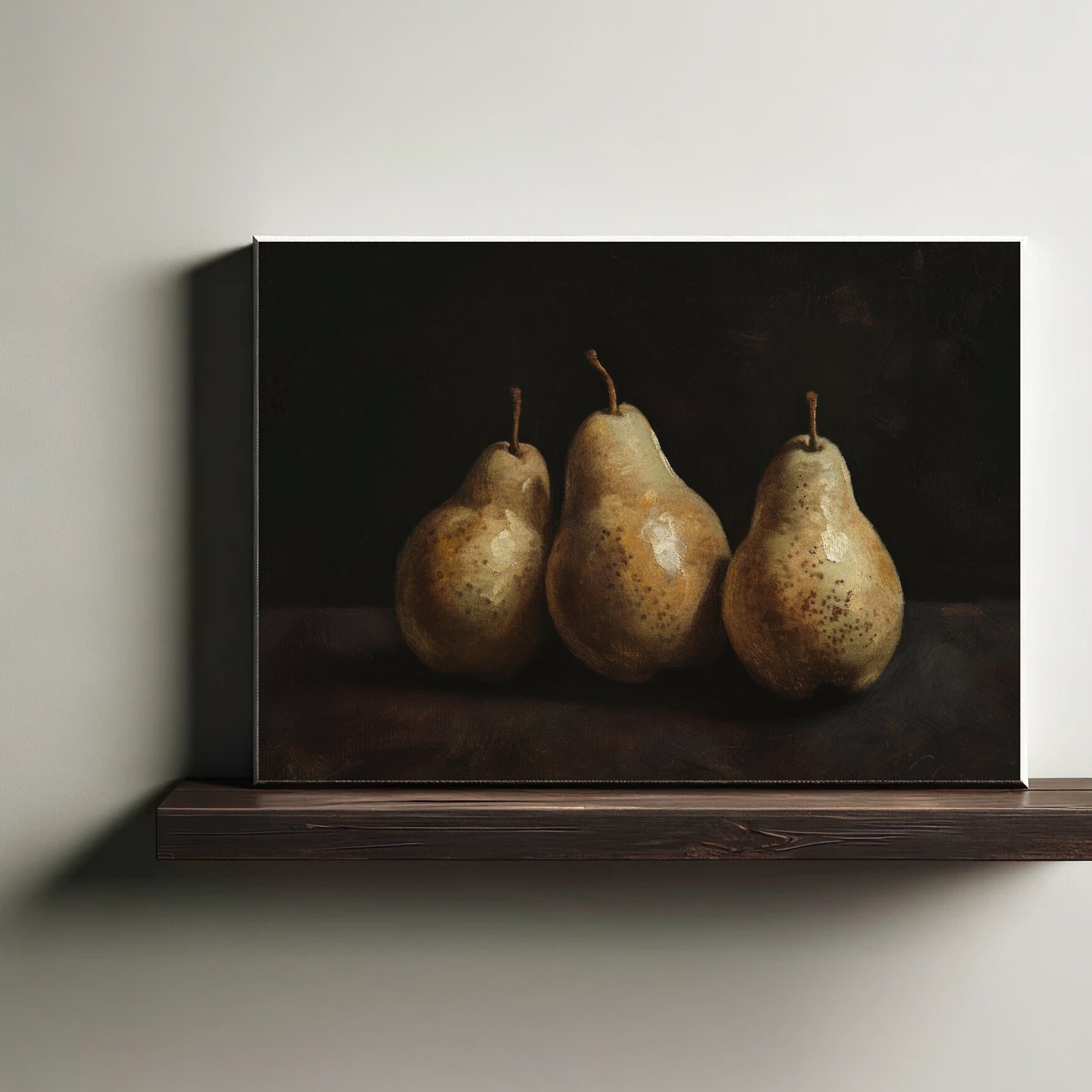 Canvas print of three pears on a dark background, displayed on a wooden shelf.
