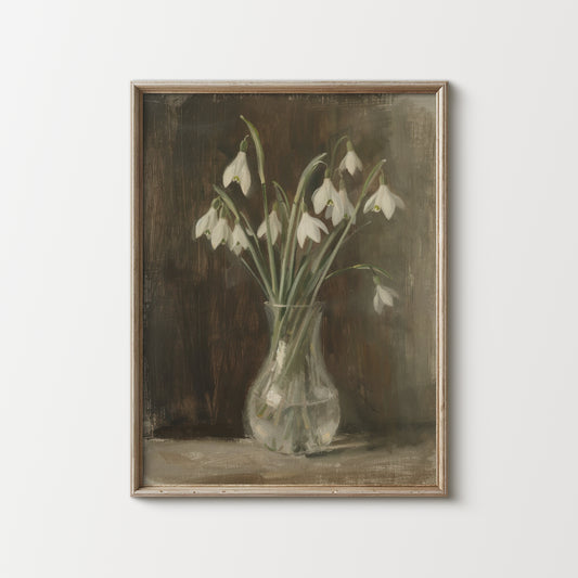Framed painting of snowdrops in a glass vase on a white wall