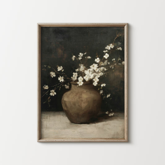Framed artwork of a vase with white flowers on a plain background