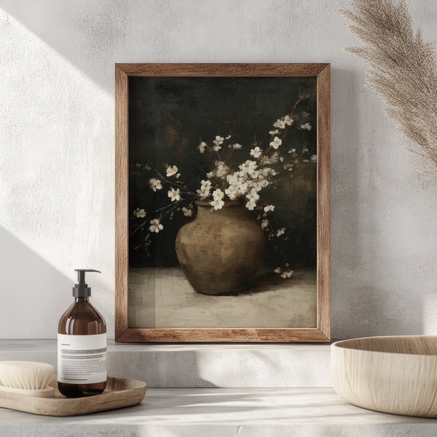Framed artwork of a vase with flowers on a shelf with a bottle and bowl.
