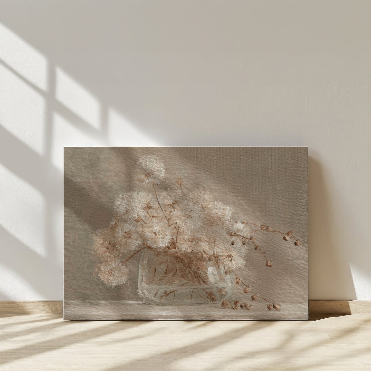 Framed artwork of dried flowers on a neutral background
