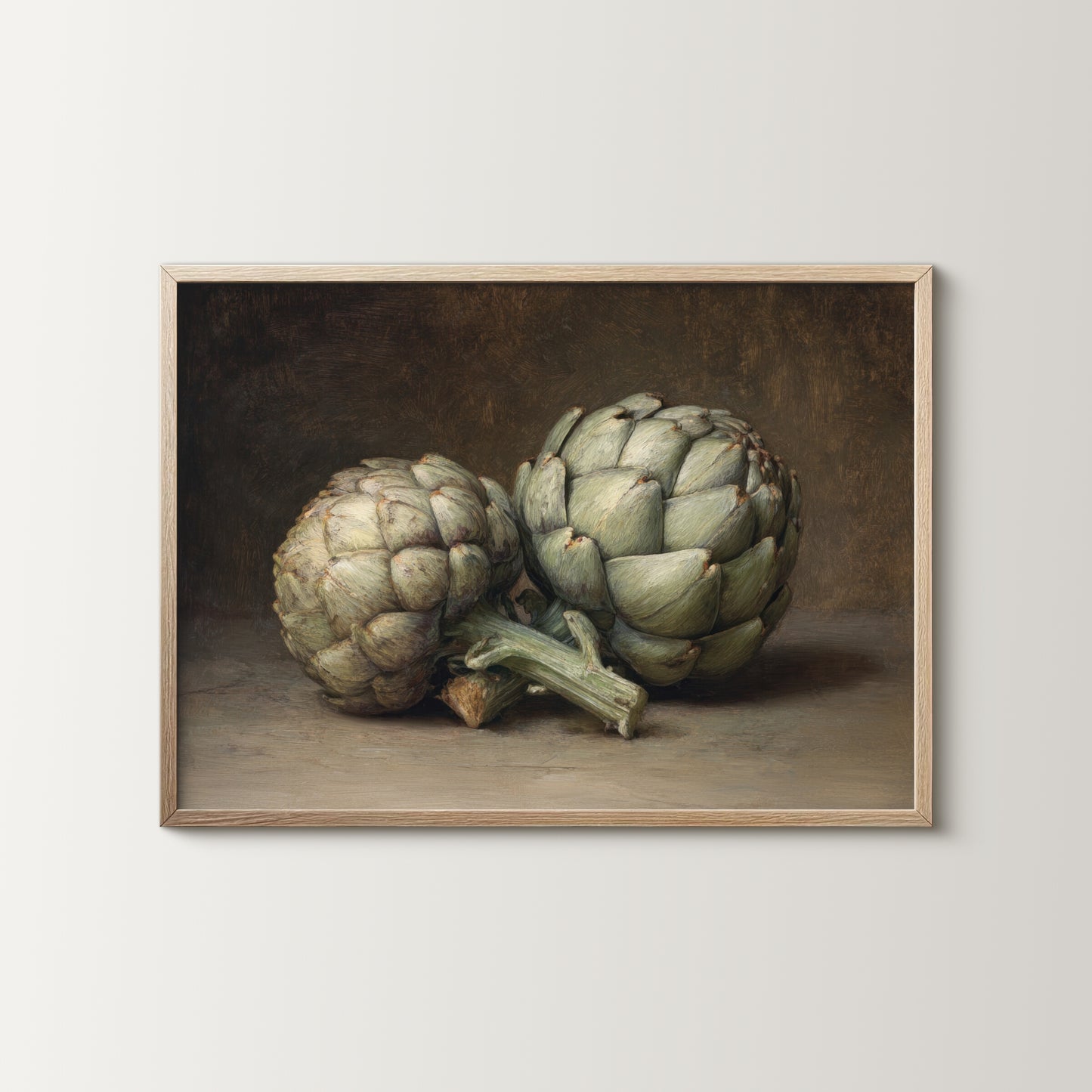 Framed artwork of two artichokes on a neutral background