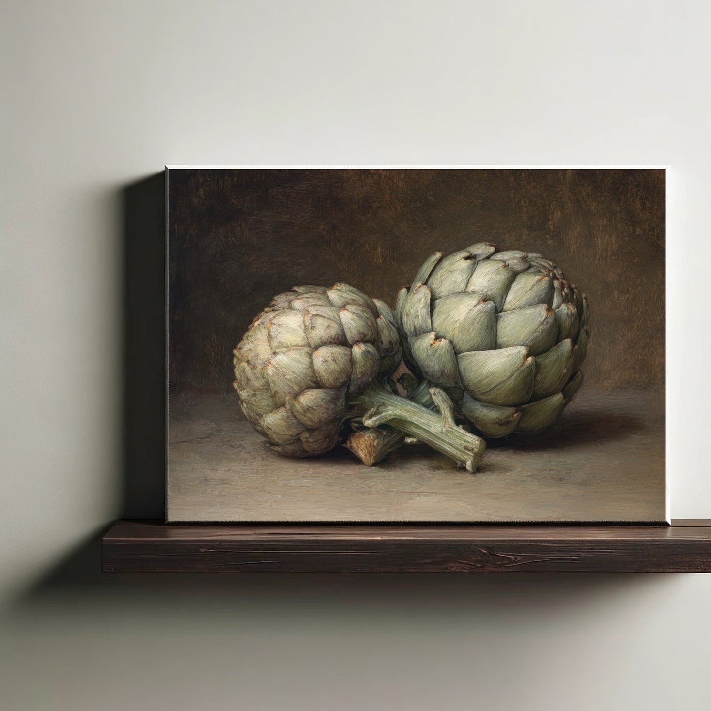 Canvas print of two artichokes on a wooden shelf against a neutral wall.