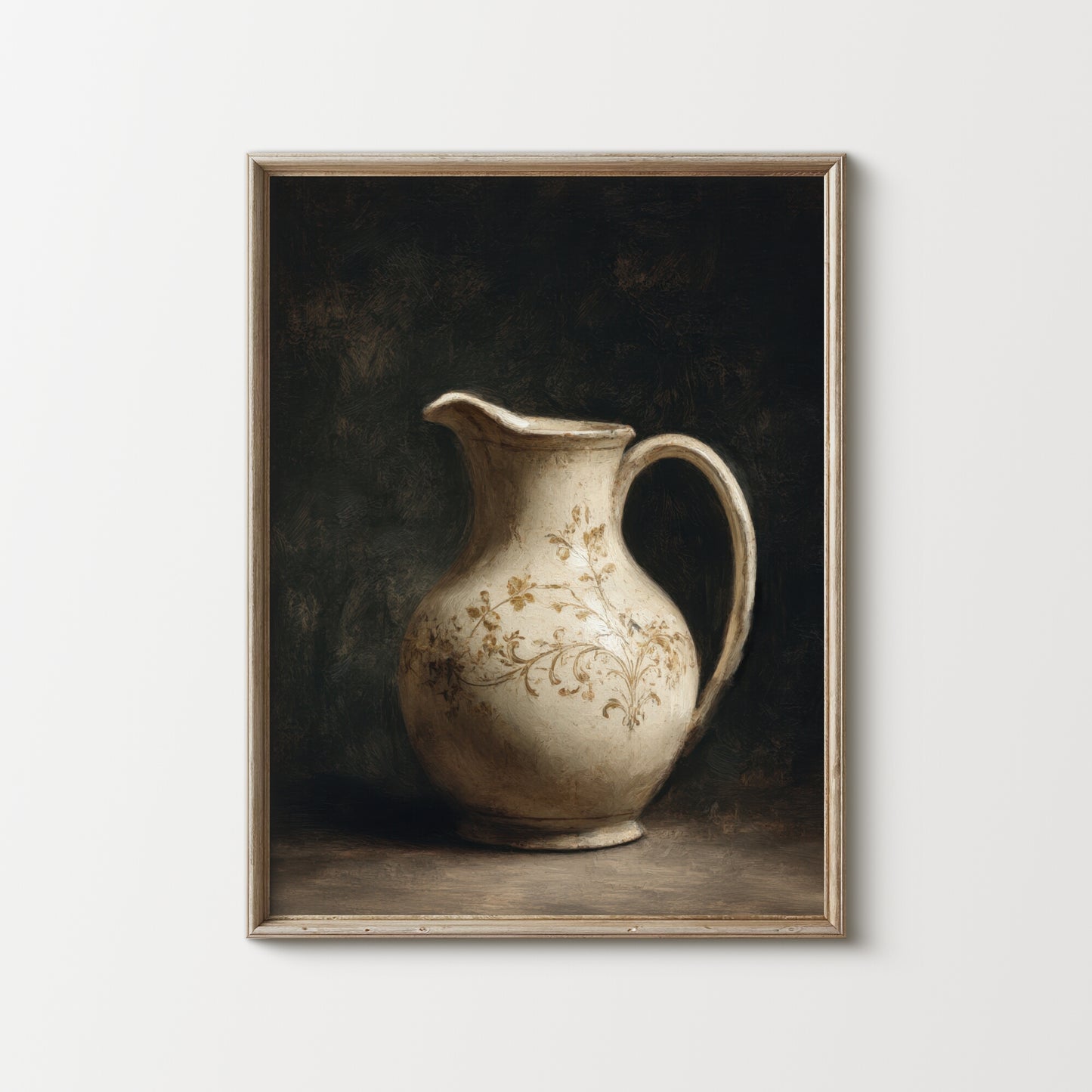 Framed artwork of a ceramic pitcher with floral patterns on a dark background