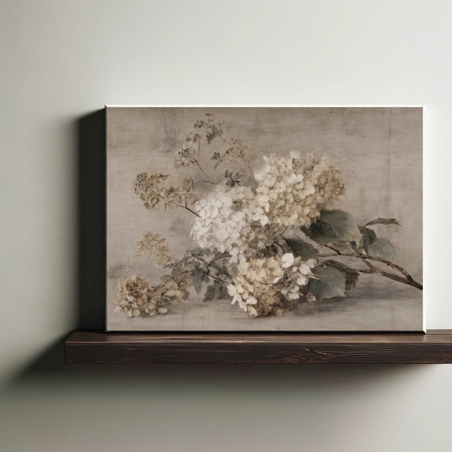 Framed floral painting on a wooden shelf against a plain wall