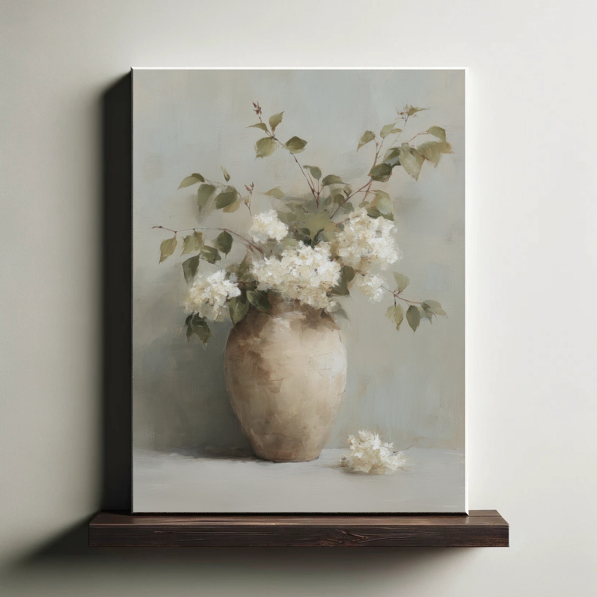Framed artwork of a vase with white flowers on a neutral background