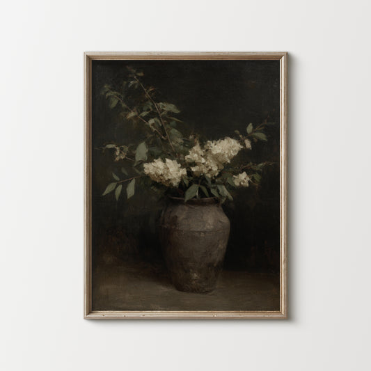 Framed artwork of a vase with flowers on a white background