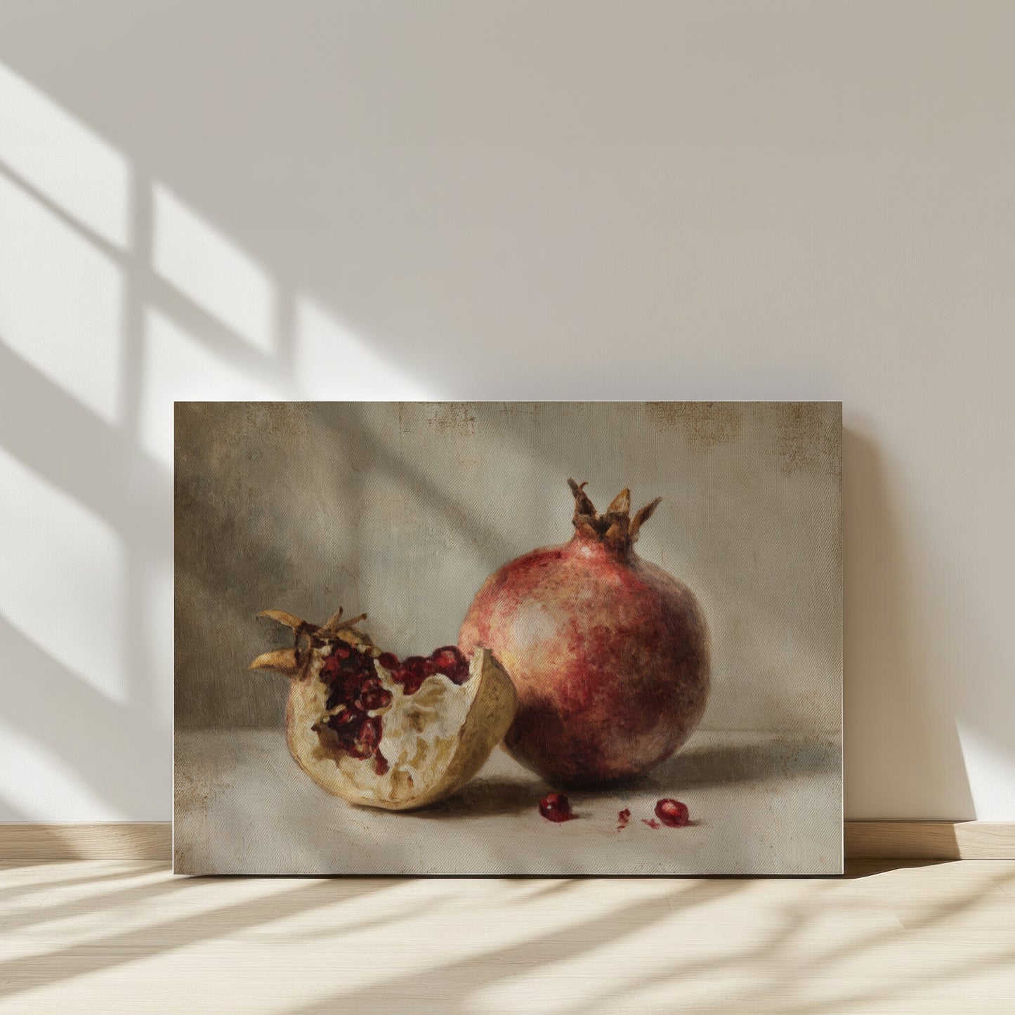 Still life painting of a pomegranate with sunlight casting shadows on a neutral background