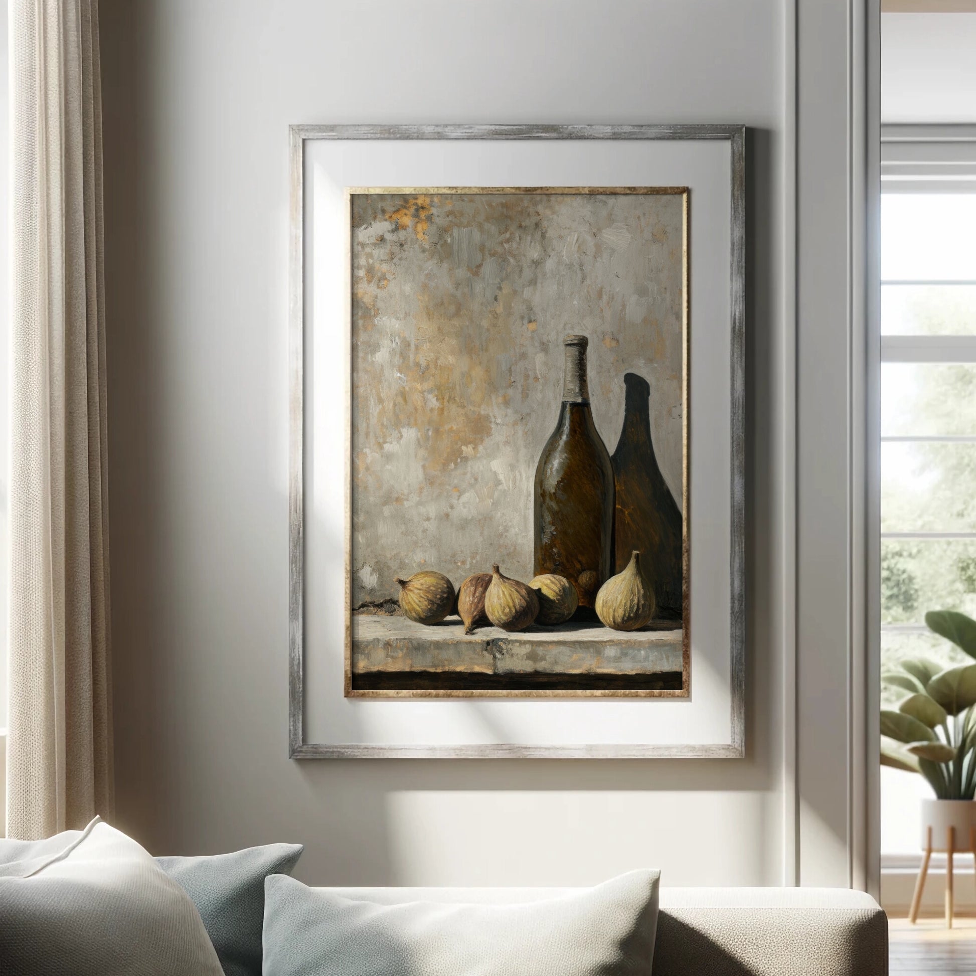 Framed artwork of bottles and figs on a wall in a living room.
