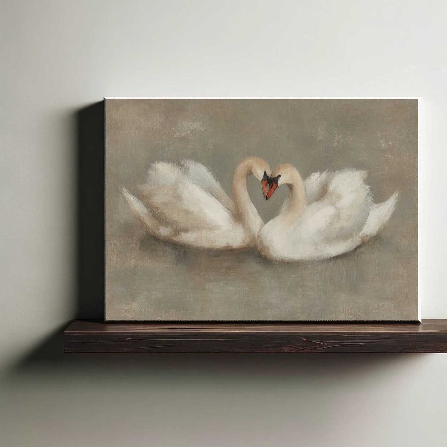 Canvas print of two swans forming a heart shape on a wooden shelf.