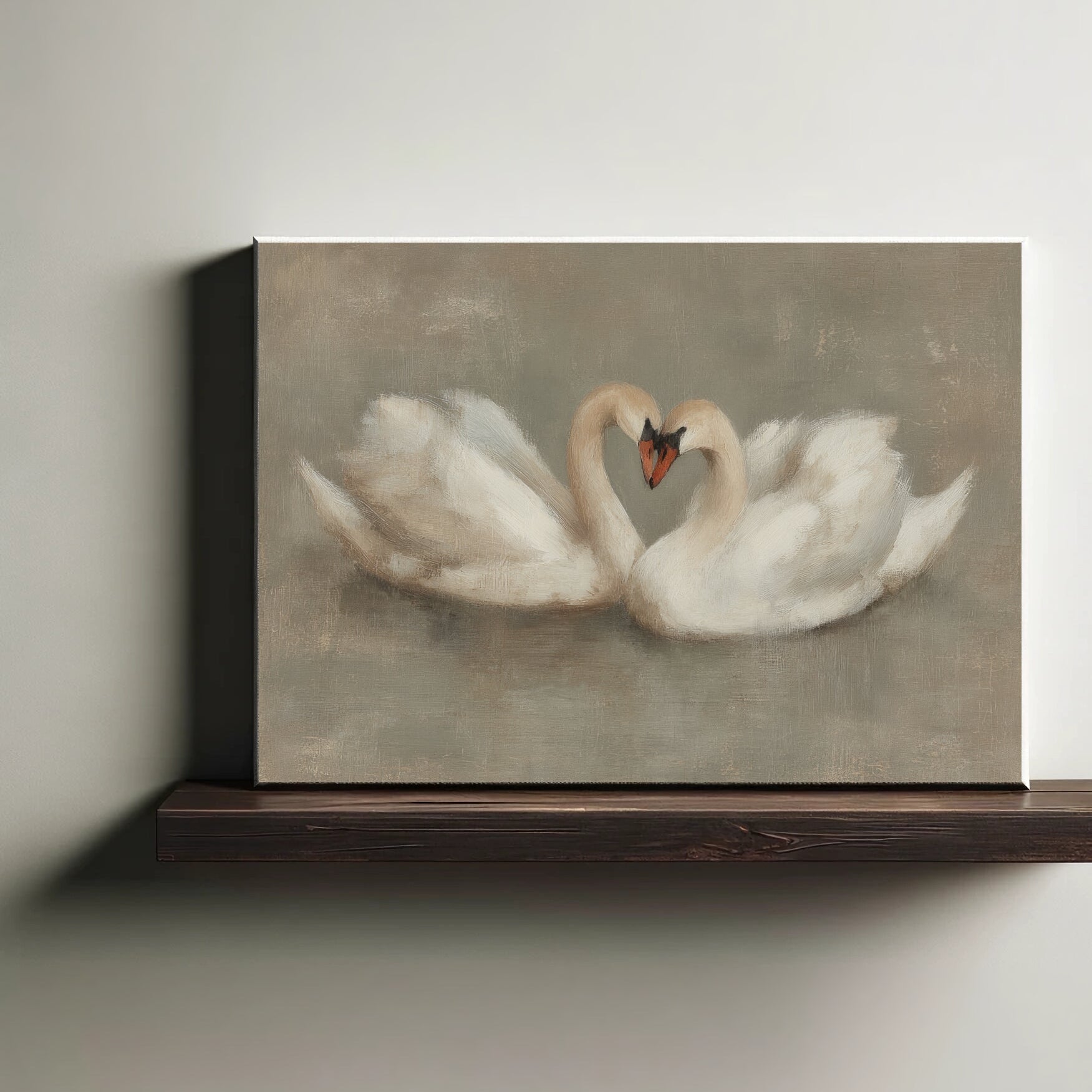 Canvas print of two swans forming a heart shape on a wooden shelf.