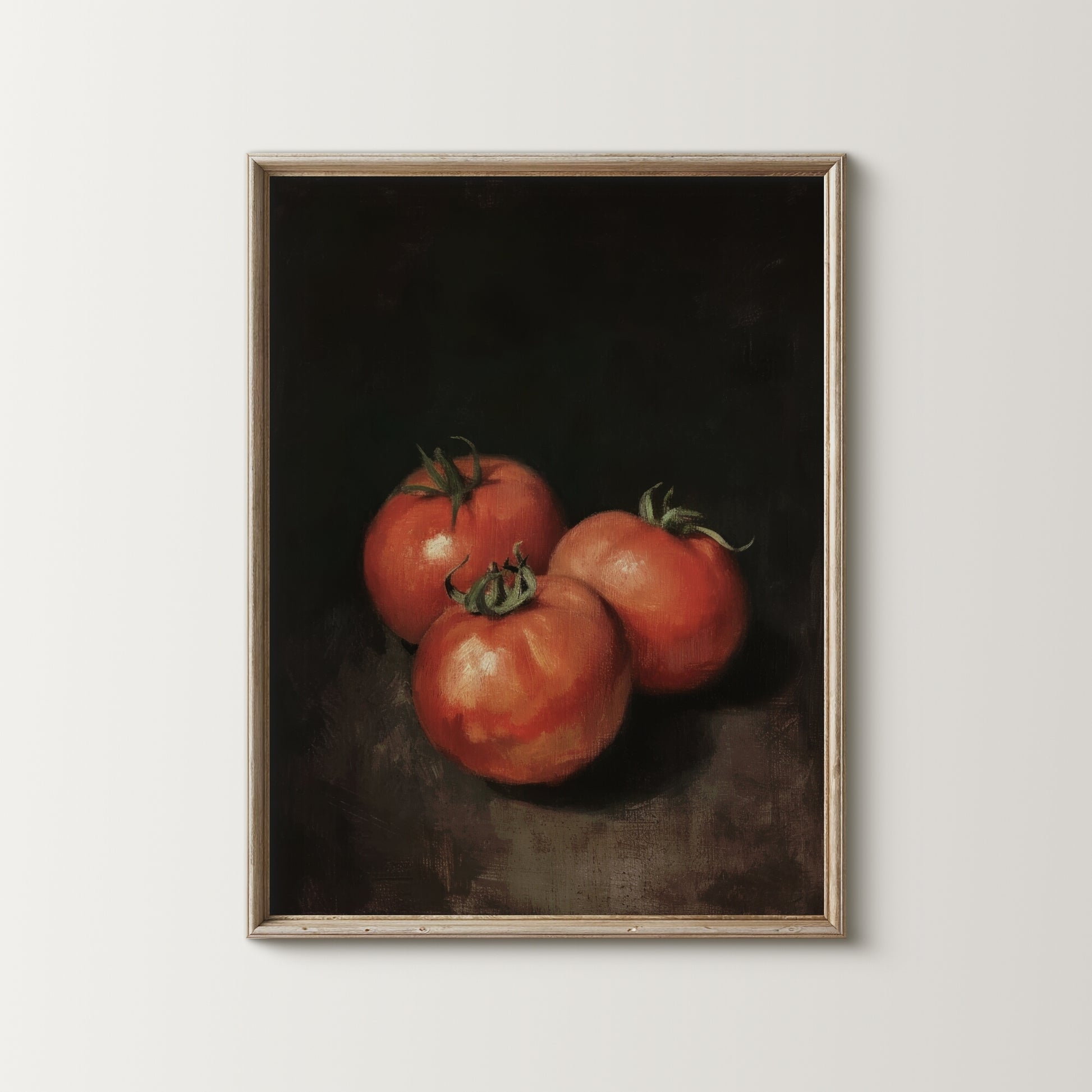 Framed artwork of three tomatoes on a dark background