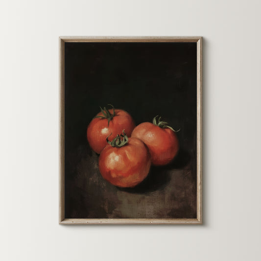 Framed artwork of three tomatoes on a dark background