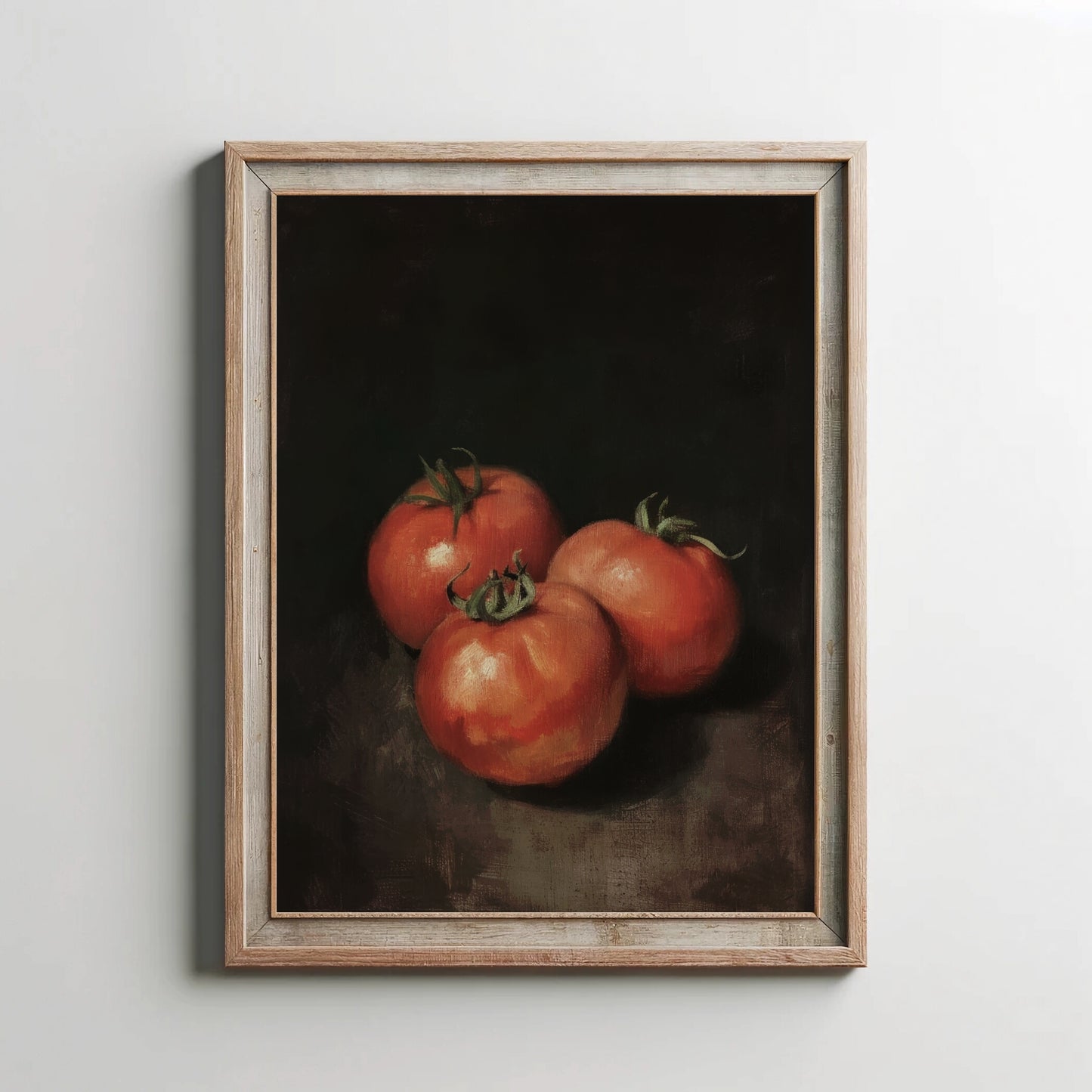 Framed artwork of three tomatoes on a dark background