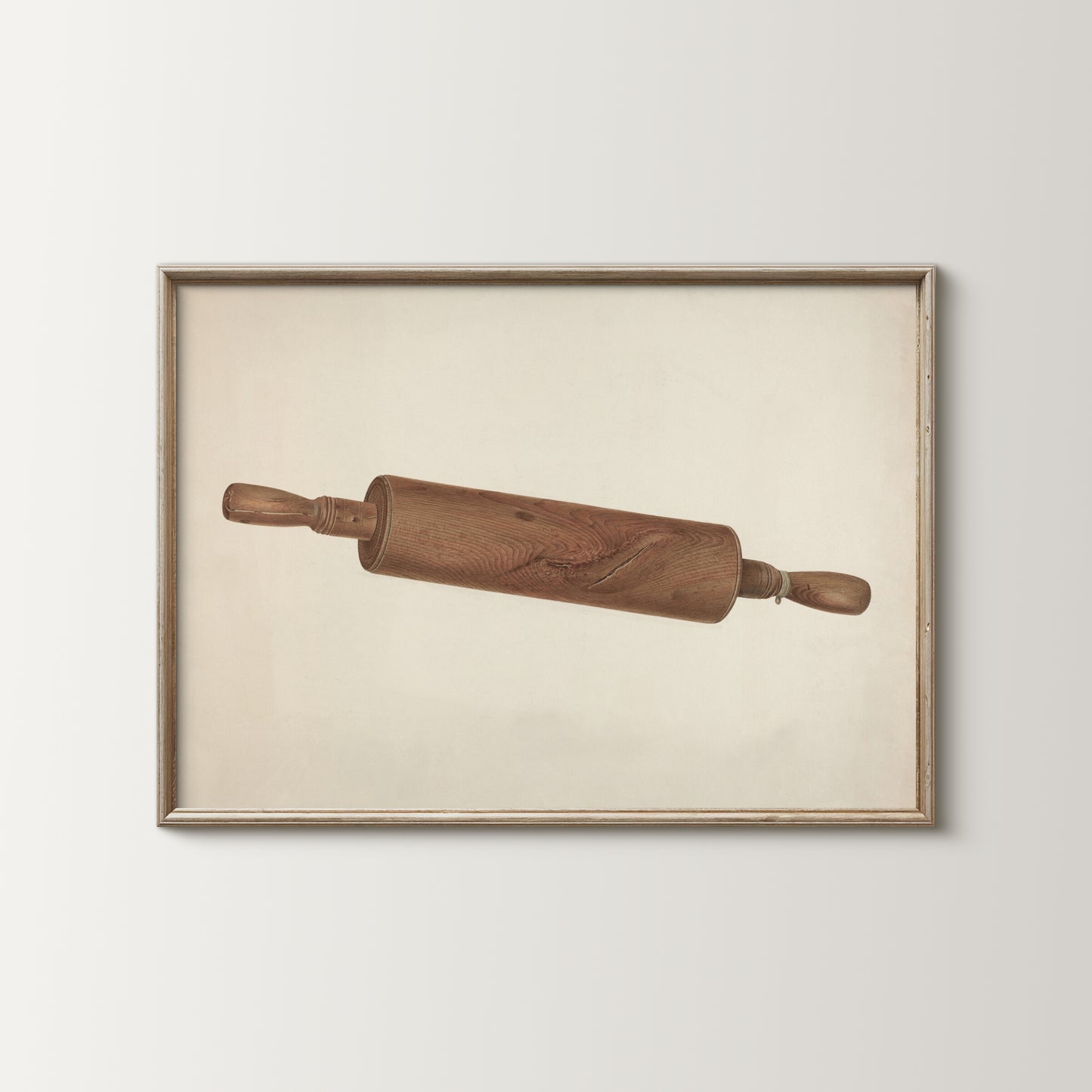 Framed artwork of a wooden rolling pin on a beige background